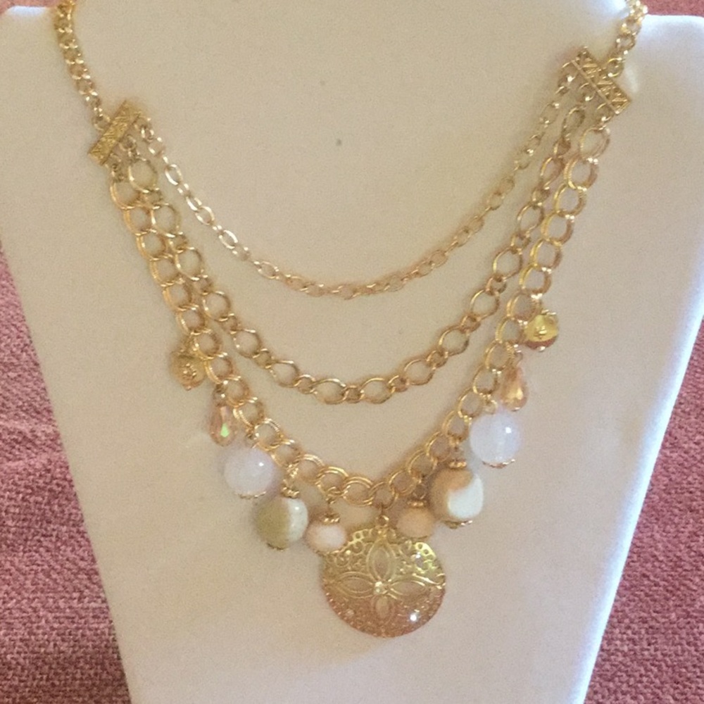 Triple strand gold tone necklace